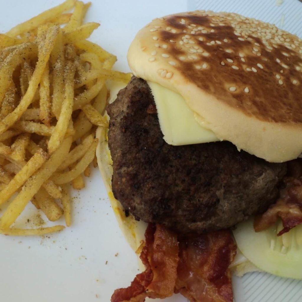 beef bacon burger and shoestring fries with cuban seasoning