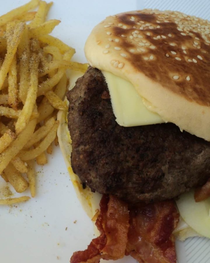 beef bacon burger and shoestring fries with cuban seasoning